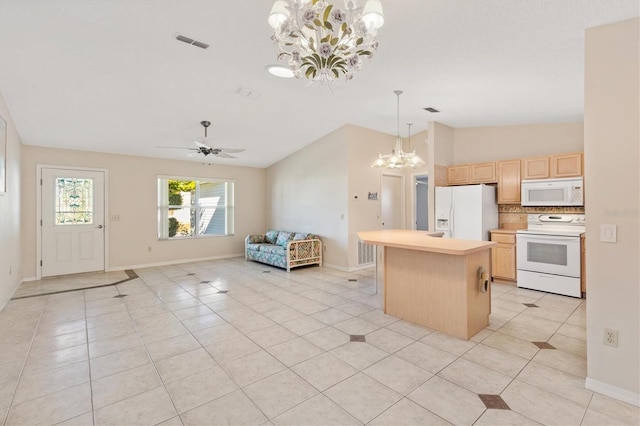 kitchen featuring light tile patterned floors, white appliances, a kitchen island, and light brown cabinets