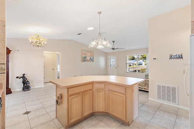 kitchen with pendant lighting, light brown cabinets, lofted ceiling, ceiling fan with notable chandelier, and a kitchen island