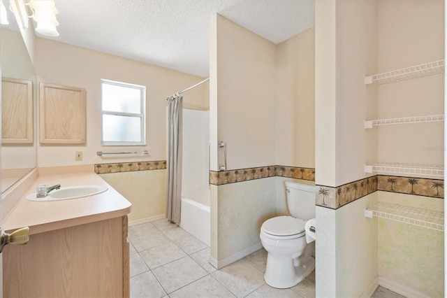 full bathroom featuring shower / bathtub combination with curtain, tile patterned floors, a textured ceiling, toilet, and vanity