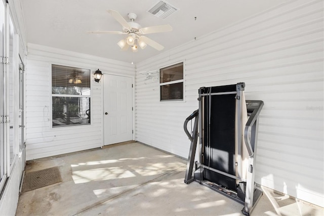 1201 De La Fuente Ct, The Villages, FL 32162 - workout room featuring a ceiling fan and wooden walls