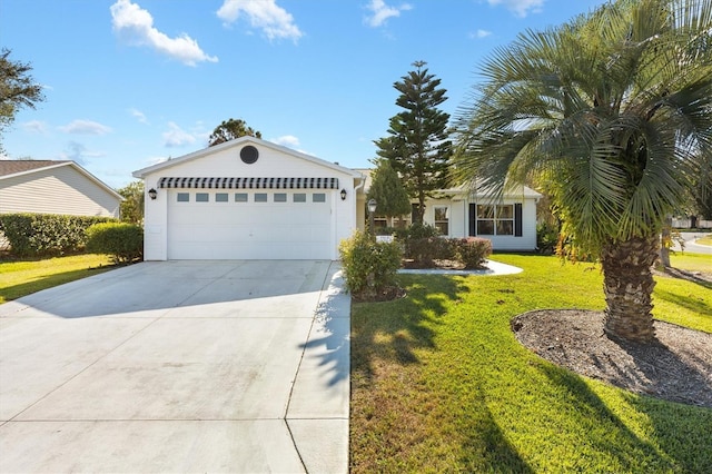 view of front facade featuring a garage and a front lawn