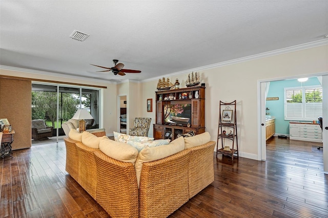 living room featuring crown molding, dark hardwood / wood-style flooring, ceiling fan, and plenty of natural light