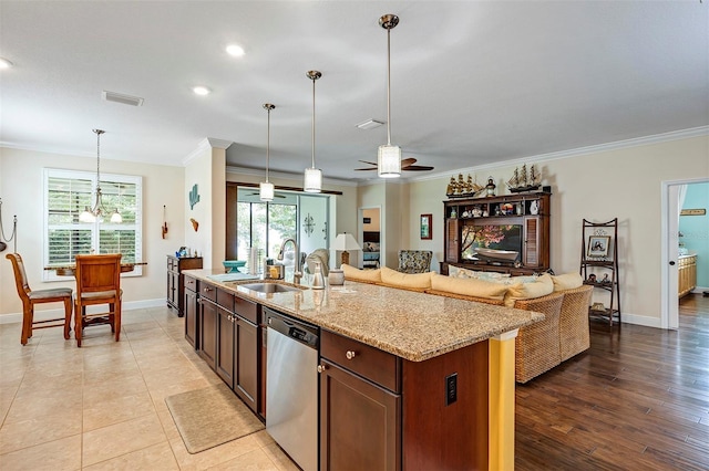 kitchen featuring dishwasher, light wood-type flooring, sink, and a wealth of natural light