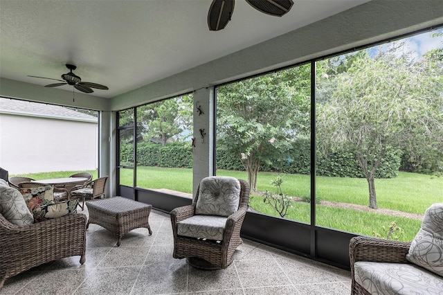 sunroom featuring a wealth of natural light and ceiling fan