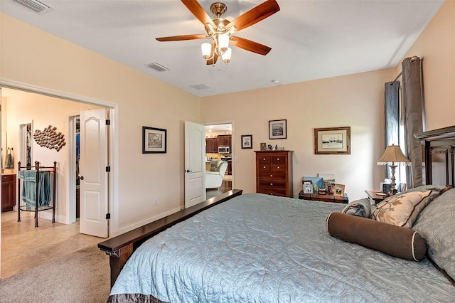 bedroom with ceiling fan and light carpet