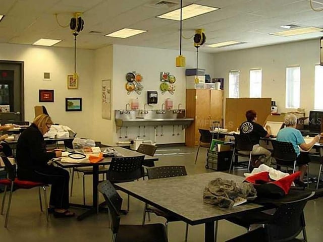 dining area featuring concrete flooring