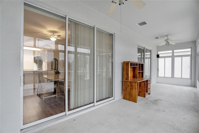 interior space featuring ceiling fan