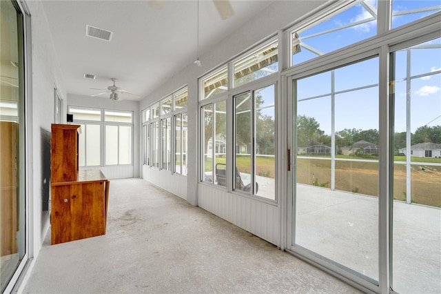 unfurnished sunroom with ceiling fan and a wealth of natural light