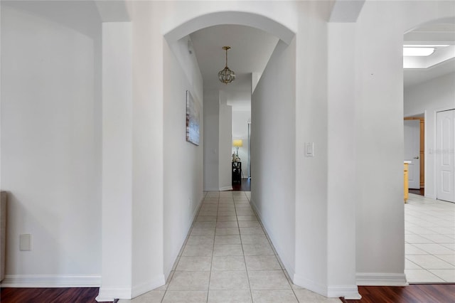 corridor featuring light tile patterned flooring