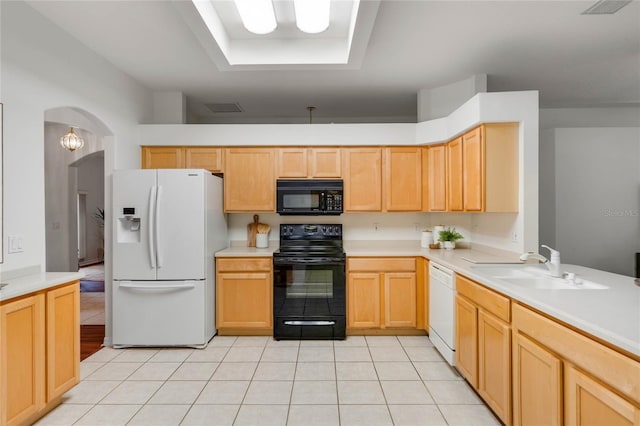 kitchen featuring light tile patterned flooring, sink, light brown cabinets, and black appliances