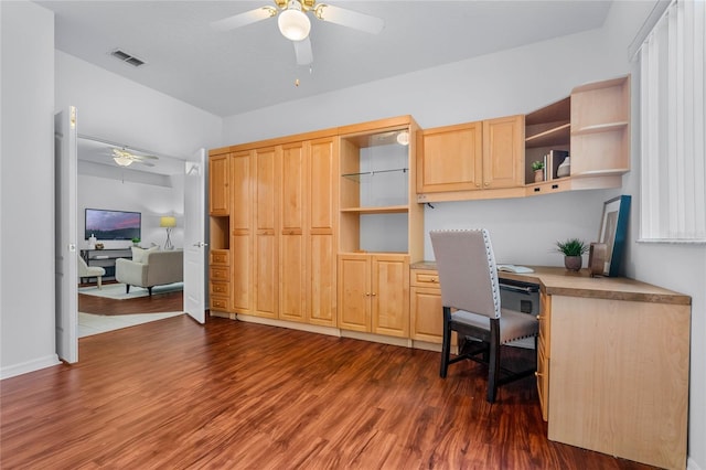 office featuring dark hardwood / wood-style floors and ceiling fan