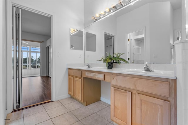 bathroom featuring tile patterned flooring and vanity