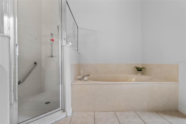 bathroom featuring tile patterned floors and plus walk in shower