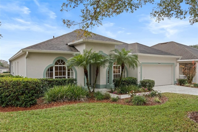 view of front of home featuring a garage and a front lawn