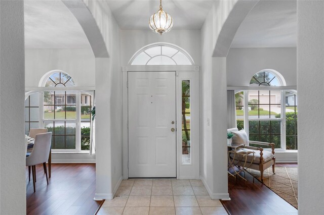 entryway with a healthy amount of sunlight and light tile patterned floors