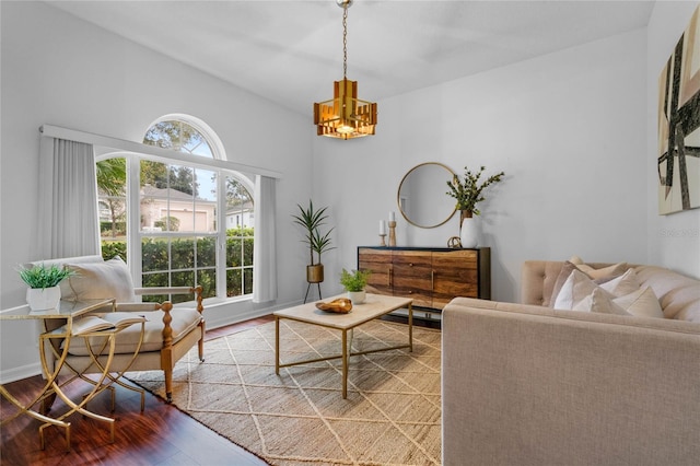 living room with a chandelier and hardwood / wood-style floors