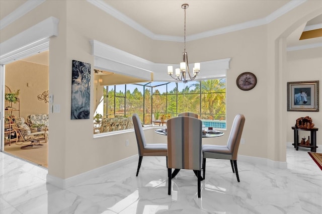 dining area with ornamental molding and a notable chandelier