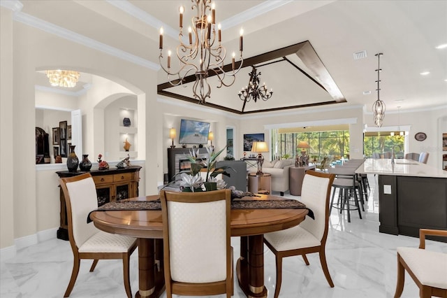 dining room featuring crown molding and sink