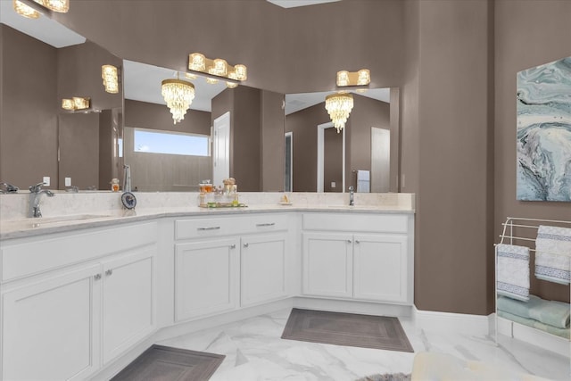 bathroom featuring vanity and a notable chandelier