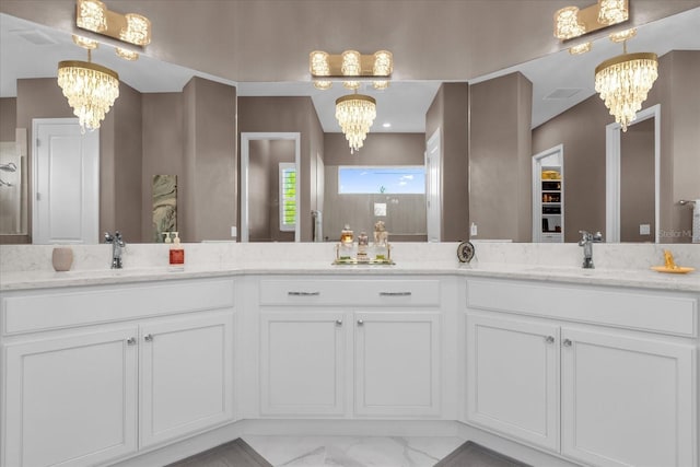 bathroom with vanity, a shower, and a chandelier