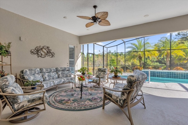 sunroom / solarium featuring ceiling fan and a swimming pool