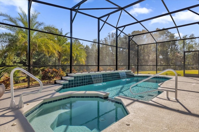 view of pool featuring an in ground hot tub, a patio, pool water feature, and glass enclosure