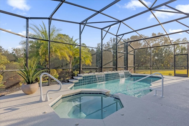 view of swimming pool featuring an in ground hot tub, a patio area, and a lanai