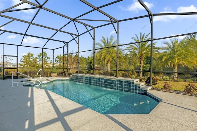 view of swimming pool with pool water feature, glass enclosure, and a patio