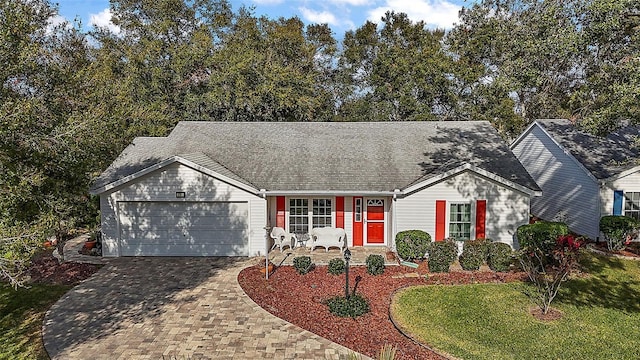 view of front of home featuring a front yard and a garage