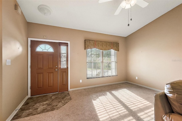 foyer entrance with light colored carpet, plenty of natural light, and ceiling fan