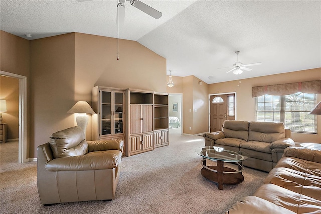 living room with carpet flooring, ceiling fan, a textured ceiling, and lofted ceiling