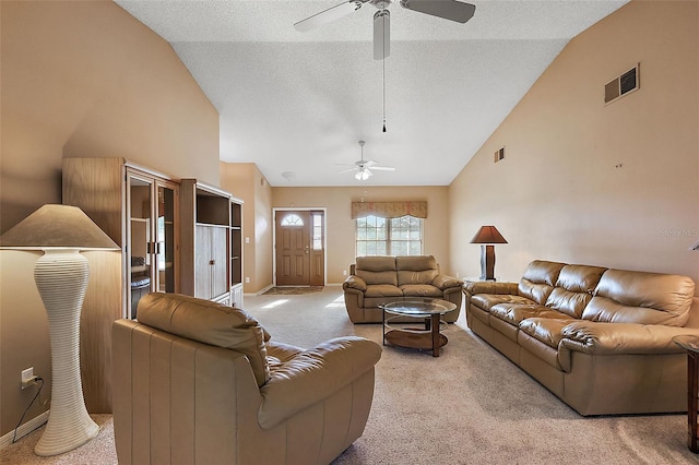 carpeted living room featuring ceiling fan, a textured ceiling, and high vaulted ceiling