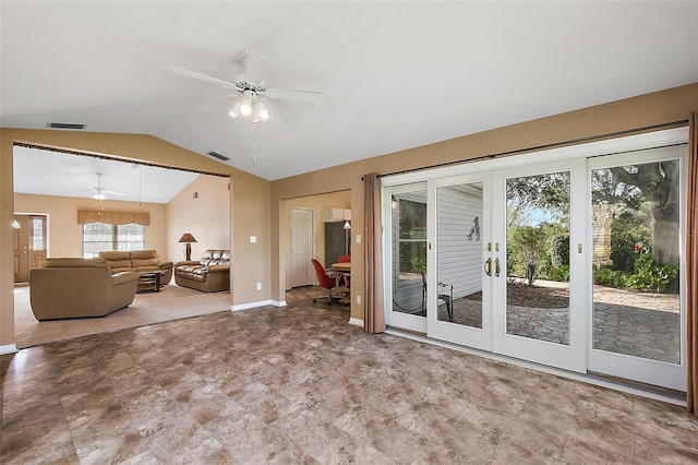 unfurnished living room featuring ceiling fan, french doors, and lofted ceiling