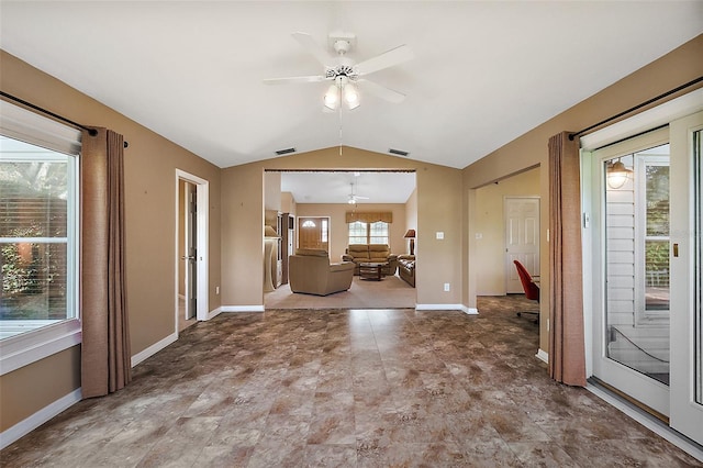 unfurnished living room featuring vaulted ceiling and ceiling fan