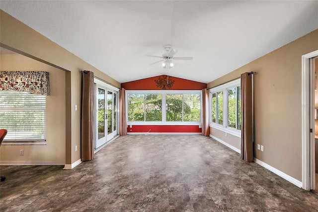 unfurnished sunroom with ceiling fan, french doors, a wealth of natural light, and vaulted ceiling