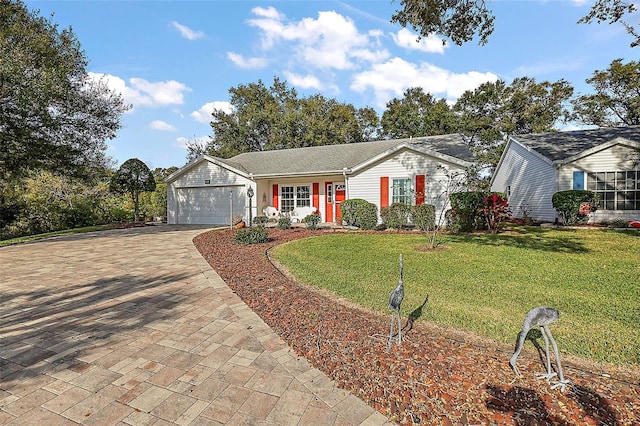 ranch-style home featuring a garage and a front yard