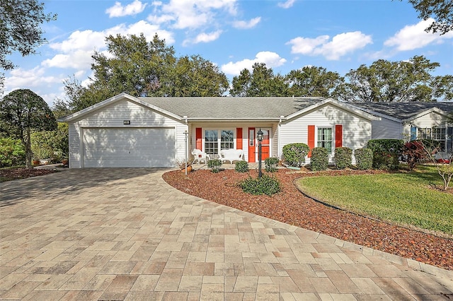 single story home with a garage and a front yard