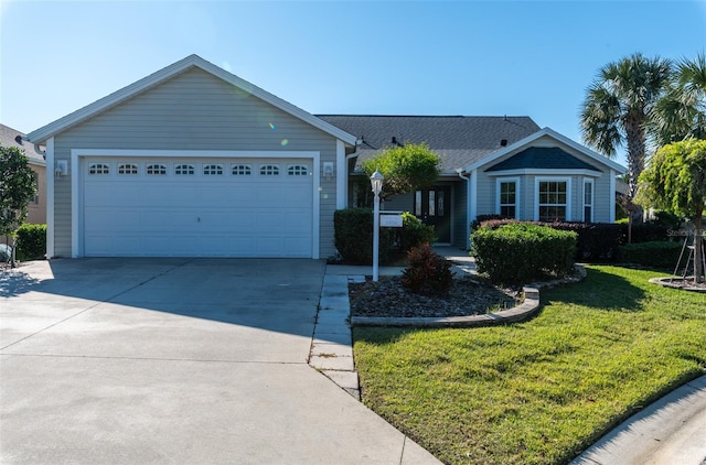 ranch-style house with a front yard and a garage