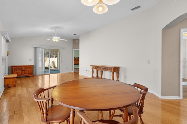 dining area featuring light wood-type flooring, vaulted ceiling, and ceiling fan