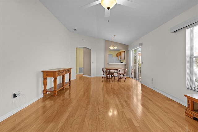 dining space featuring ceiling fan, plenty of natural light, light hardwood / wood-style floors, and lofted ceiling