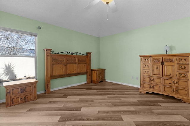 bedroom with light wood-type flooring and ceiling fan