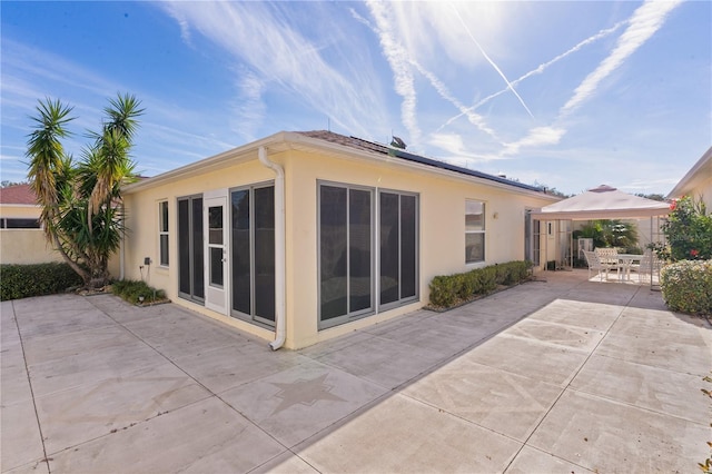 rear view of house with a patio area