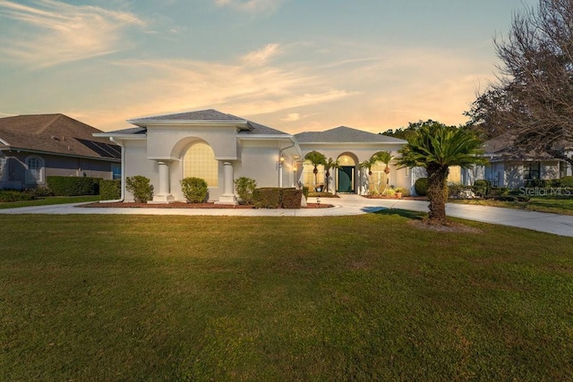 mediterranean / spanish-style house featuring a yard