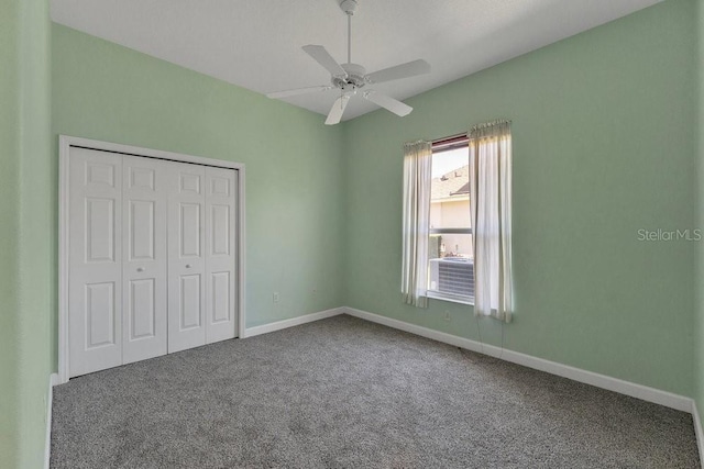 unfurnished bedroom featuring carpet, ceiling fan, and a closet