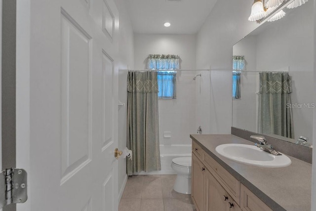 full bathroom with tile patterned floors, vanity, shower / bath combo, and toilet