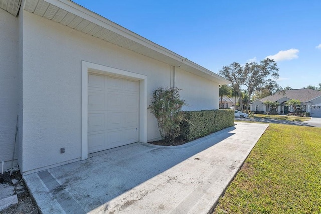 view of side of home with a yard