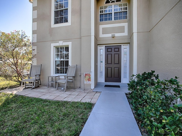 property entrance with a patio