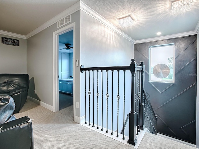 stairway featuring carpet floors and crown molding