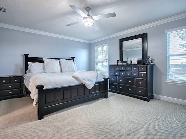 bedroom with light colored carpet, ceiling fan, and ornamental molding