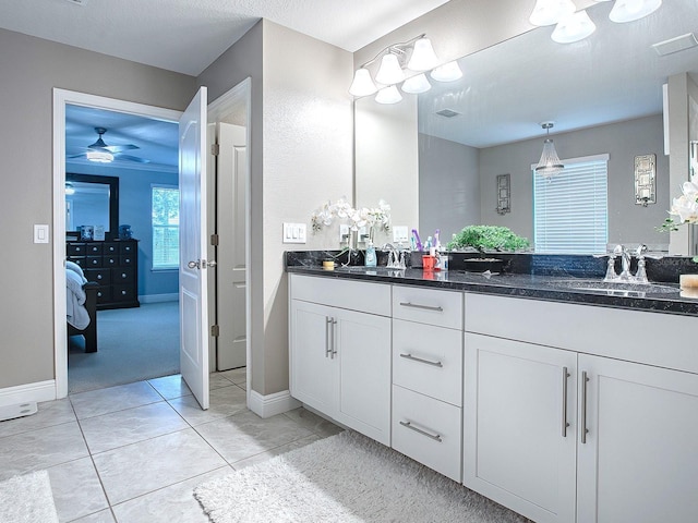 bathroom featuring vanity, tile patterned floors, and ceiling fan